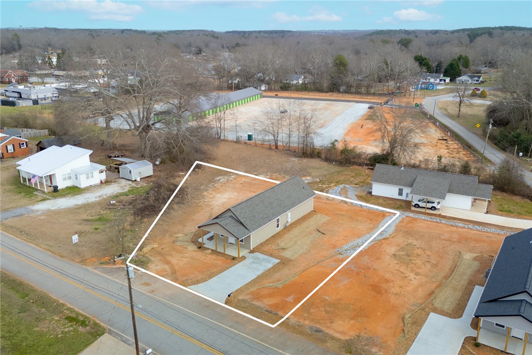 115 Riley Street Westminster, SC 29693 - Photo 40 of 46 An aerial view showcases a newly constructed single-family home with a spacious lot.