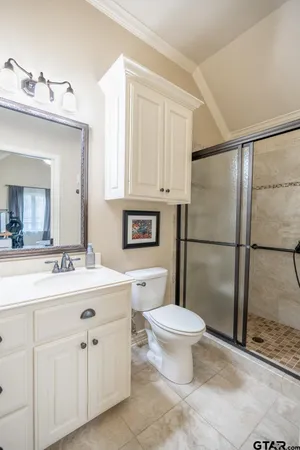 a bed room with a bed and a chandelier