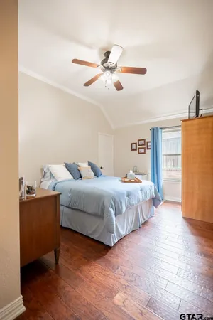 a living room with a flat screen tv and a rug
