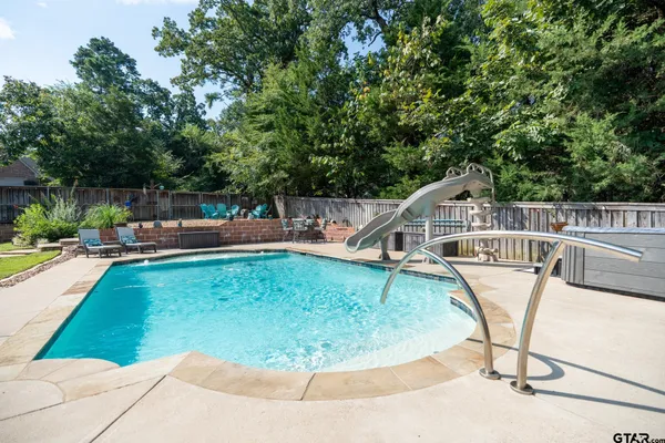 a view of outdoor space yard and swimming pool