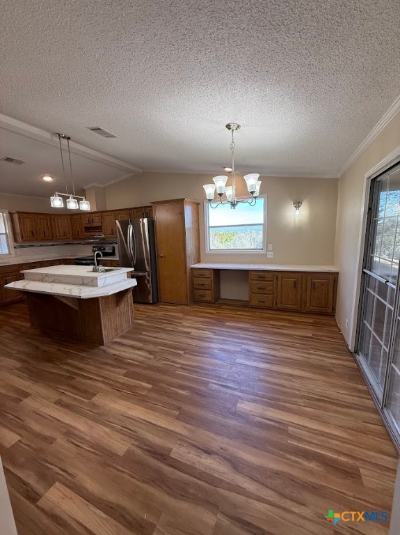 4551 Chamberlain Way Canyon Lake, TX 78133 - Photo 17 of 34 a view of a kitchen with a sink and chandelier