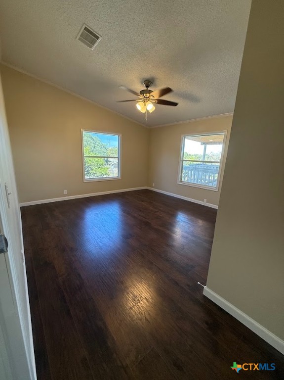 4551 Chamberlain Way Canyon Lake, TX 78133 - Photo 22 of 34 an empty room with wooden floor and windows