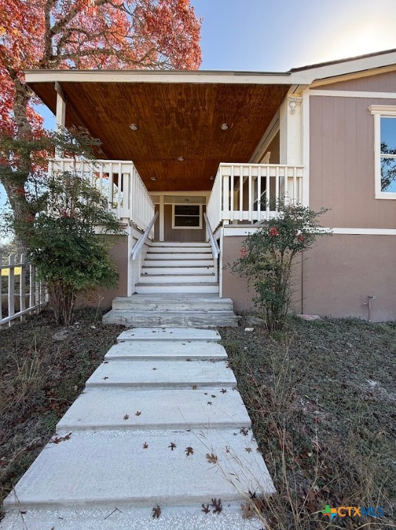 4551 Chamberlain Way Canyon Lake, TX 78133 - Photo 27 of 34 a view of a house with a yard
