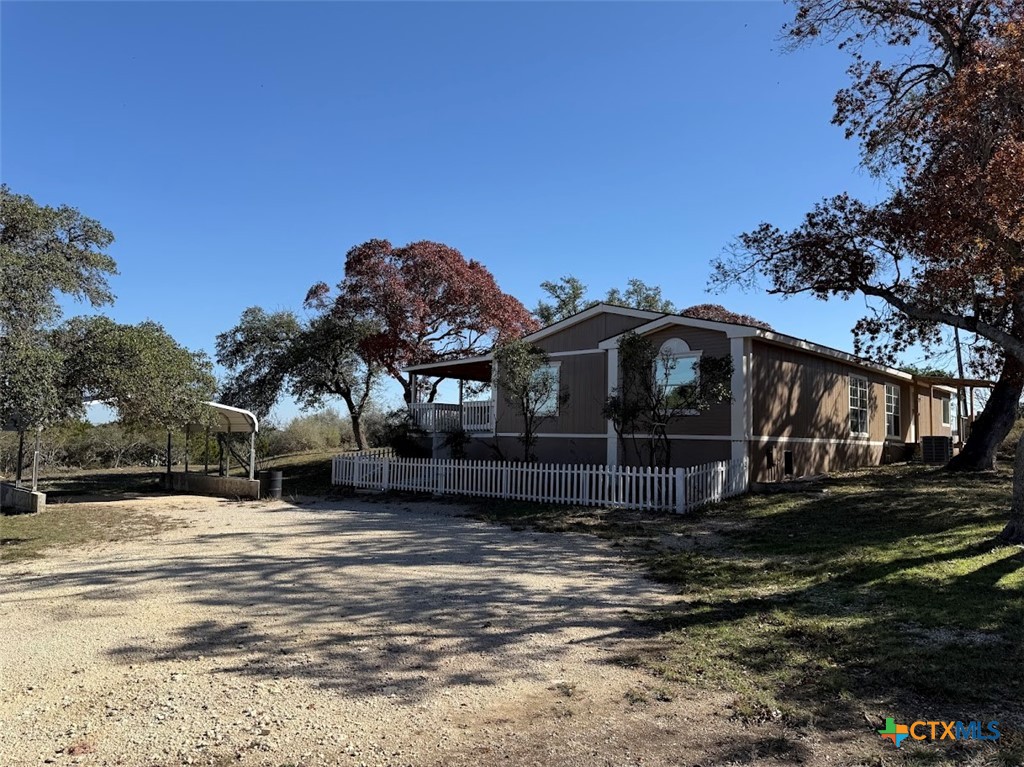 4551 Chamberlain Way Canyon Lake, TX 78133 - Photo 33 of 34 a view of a house with a yard