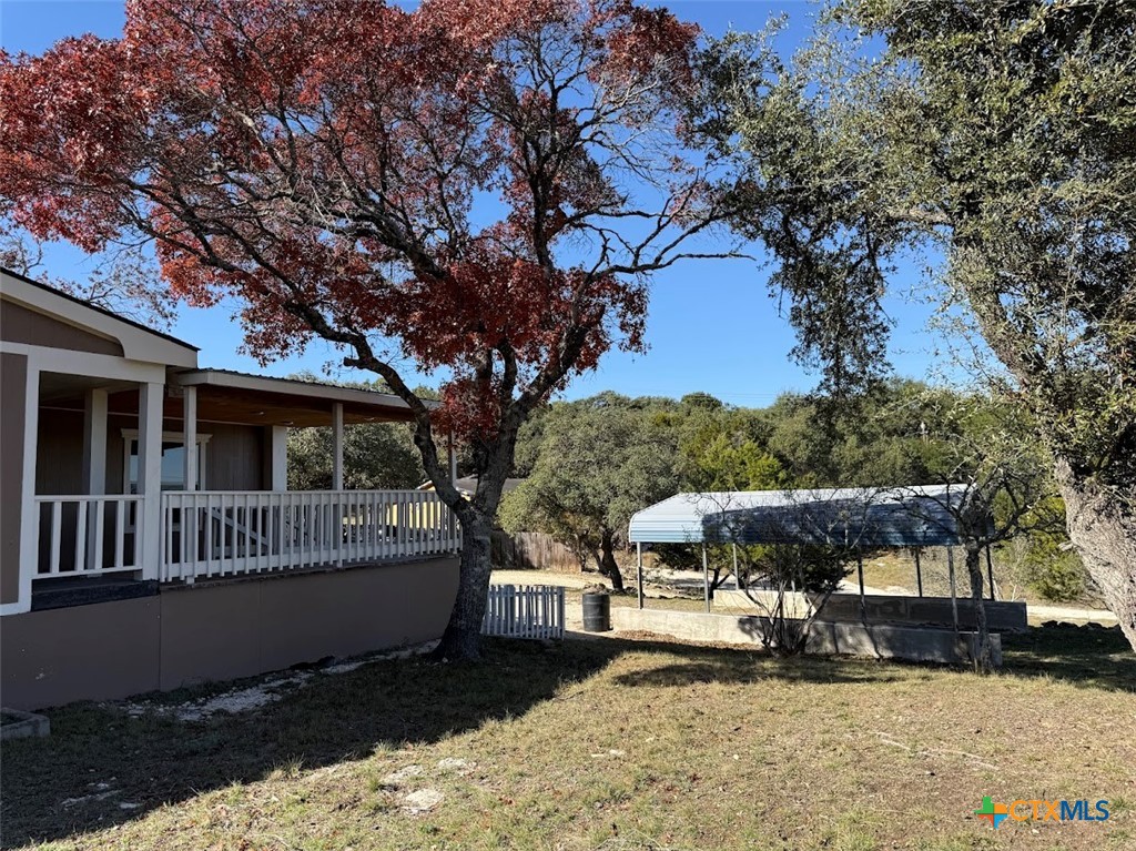 4551 Chamberlain Way Canyon Lake, TX 78133 - Photo 4 of 34 a view of a house with a yard covered with snow in front of house