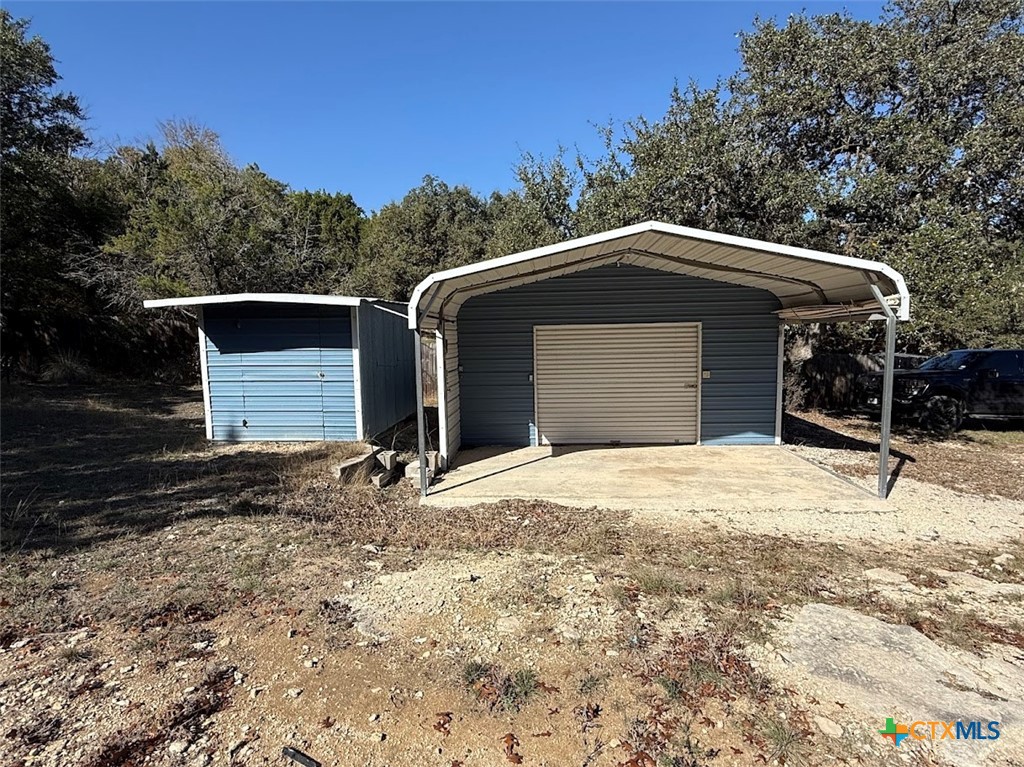 4551 Chamberlain Way Canyon Lake, TX 78133 - Photo 6 of 34 a house with trees in the background