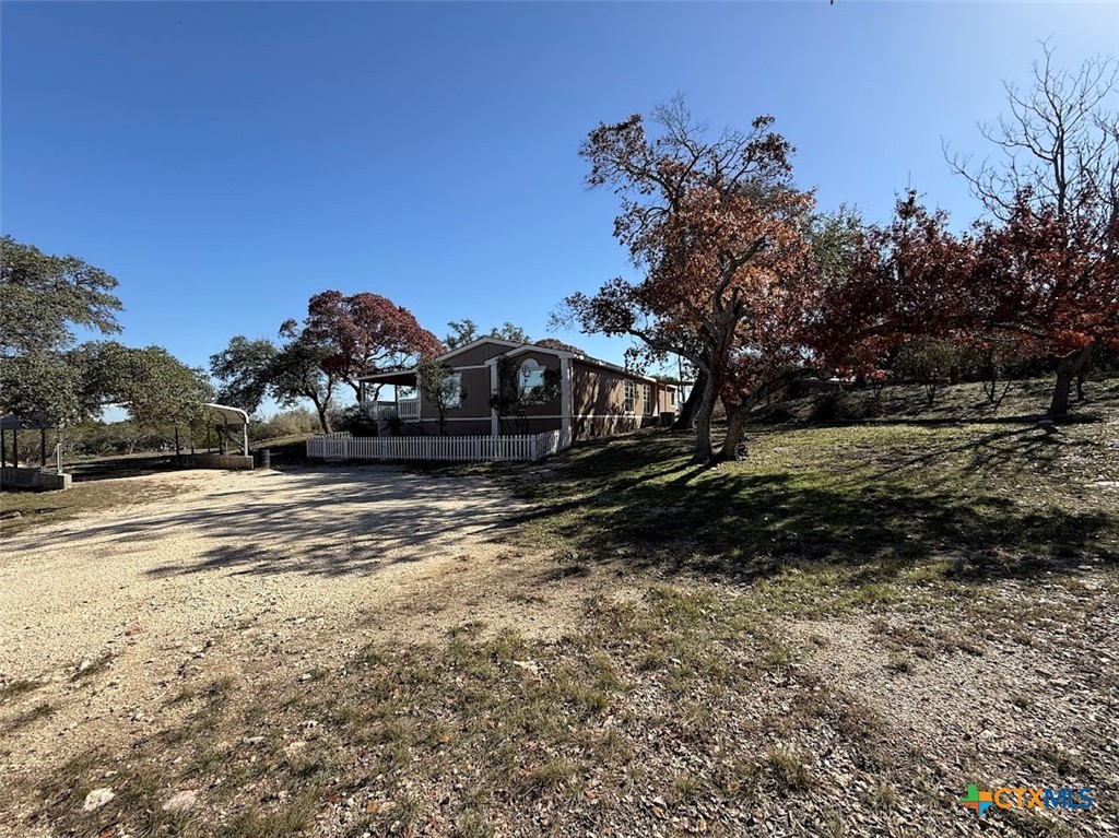 4551 Chamberlain Way Canyon Lake, TX 78133 - Photo 10 of 34 a view of a house with a yard