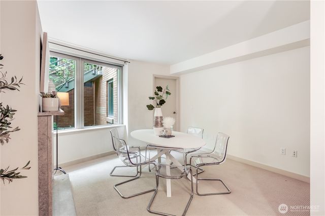 a dining room with furniture and a fireplace