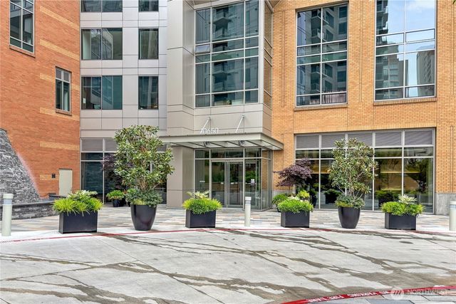 a view of a building with potted plants
