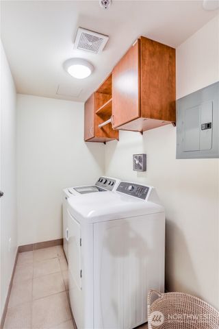 a living room with furniture and large windows