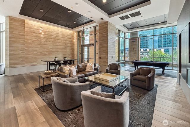 a living room with stainless steel appliances kitchen island granite countertop furniture and a kitchen view