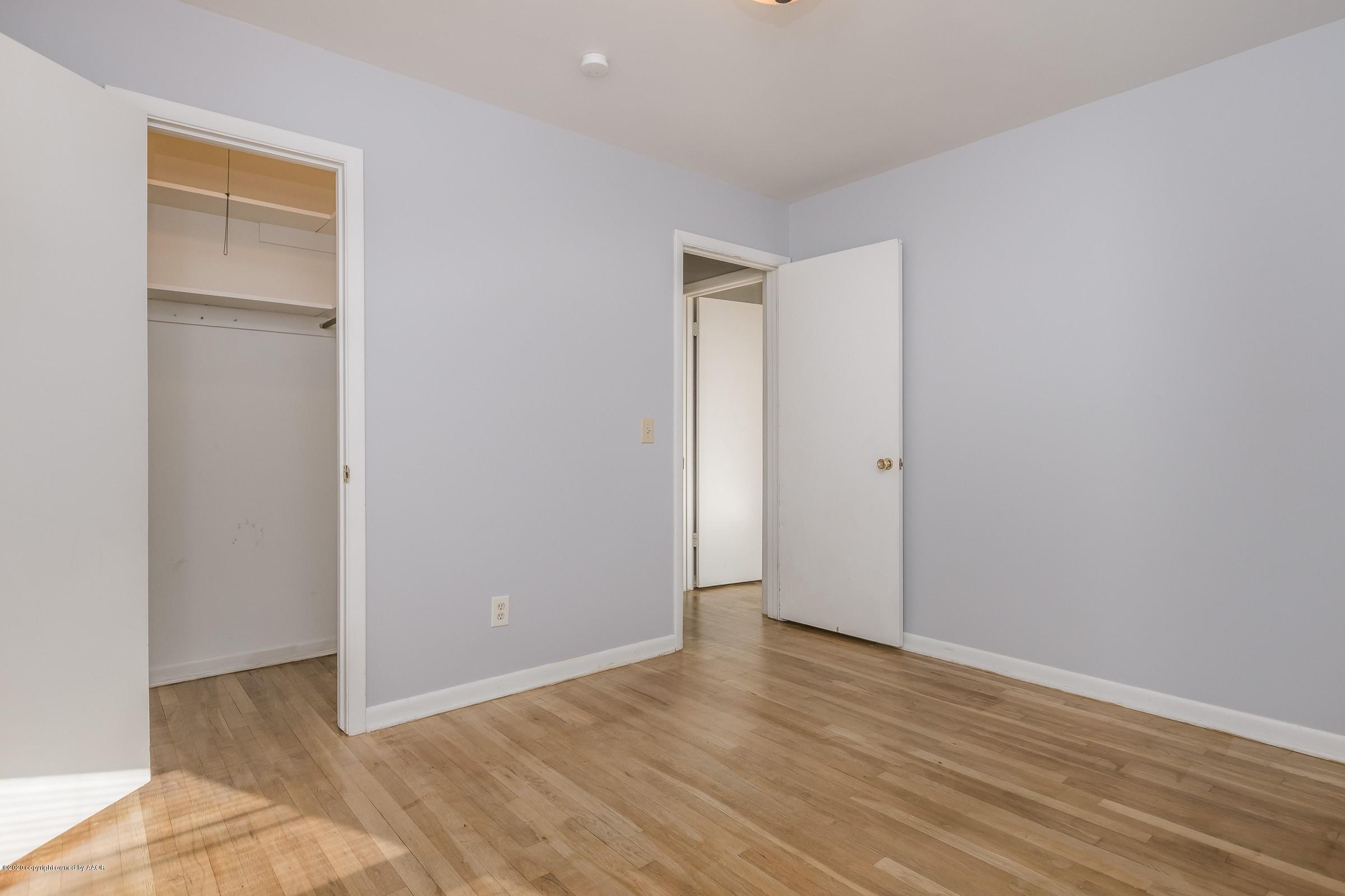4200 South Bonham Street Amarillo, TX 79110 - Photo 14 of 20 a view of an empty room with wooden floor