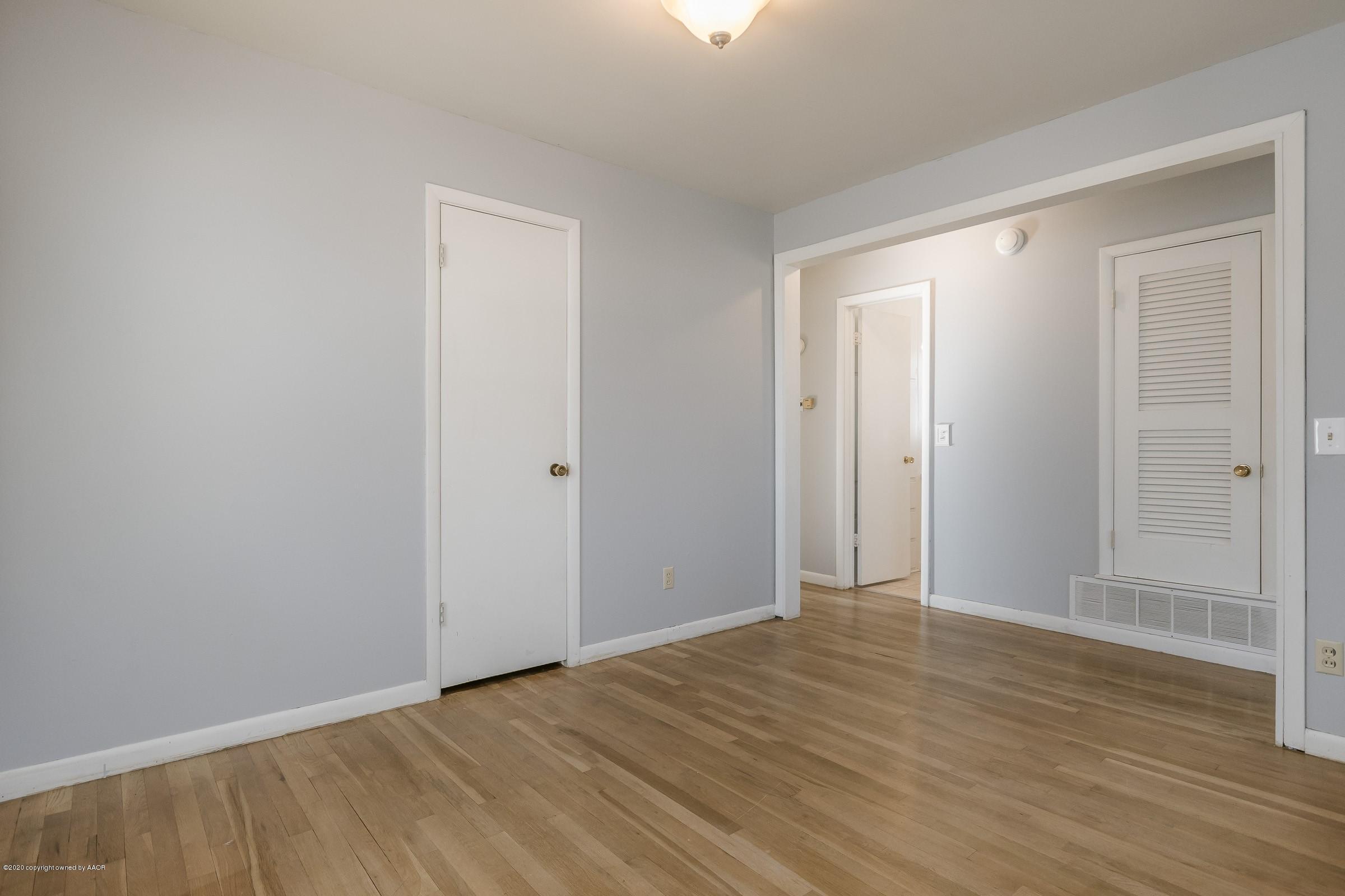 4200 South Bonham Street Amarillo, TX 79110 - Photo 4 of 20 a view of an empty room with wooden floor