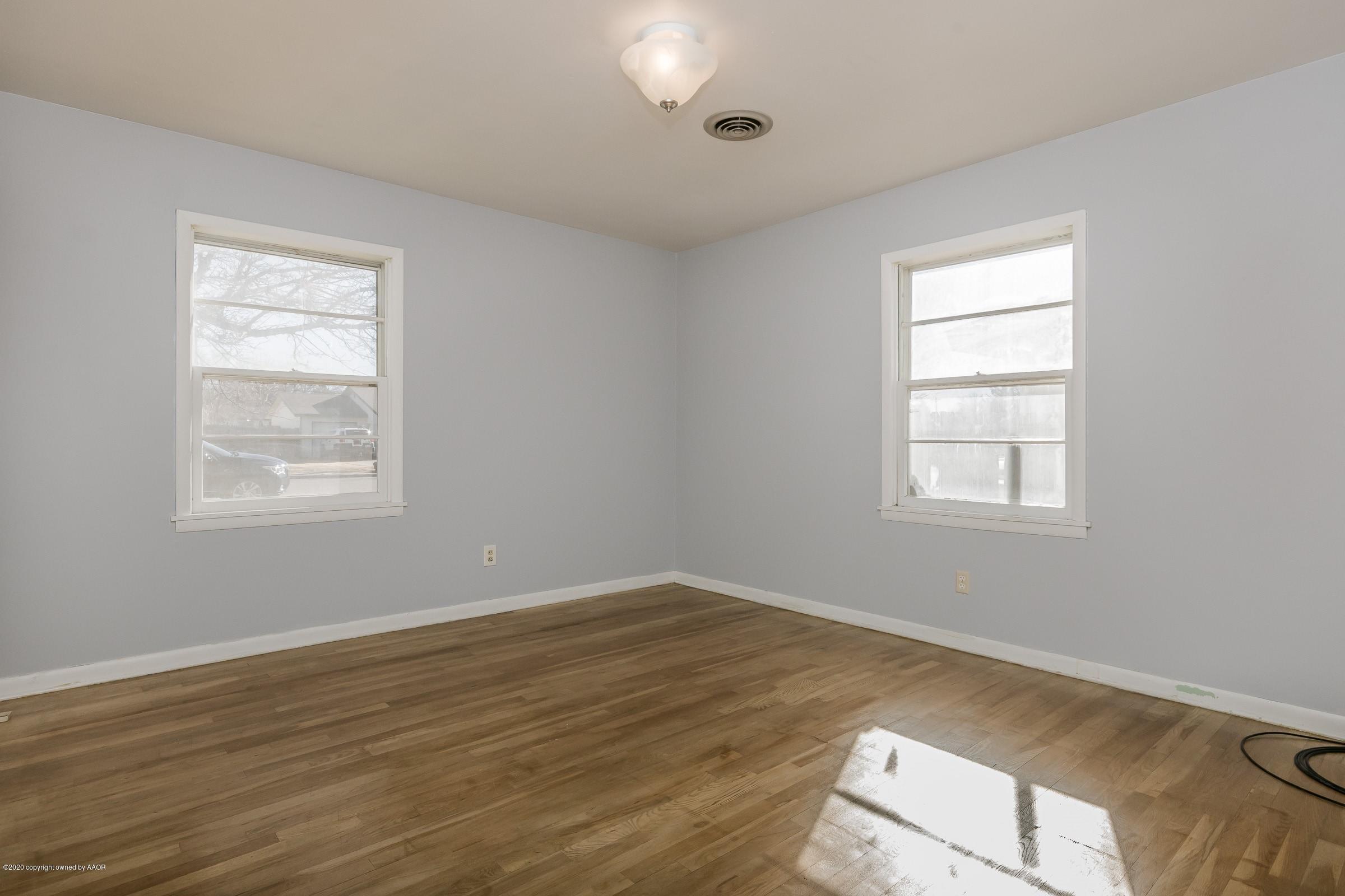 4200 South Bonham Street Amarillo, TX 79110 - Photo 10 of 20 a view of a room with wooden floor and windows