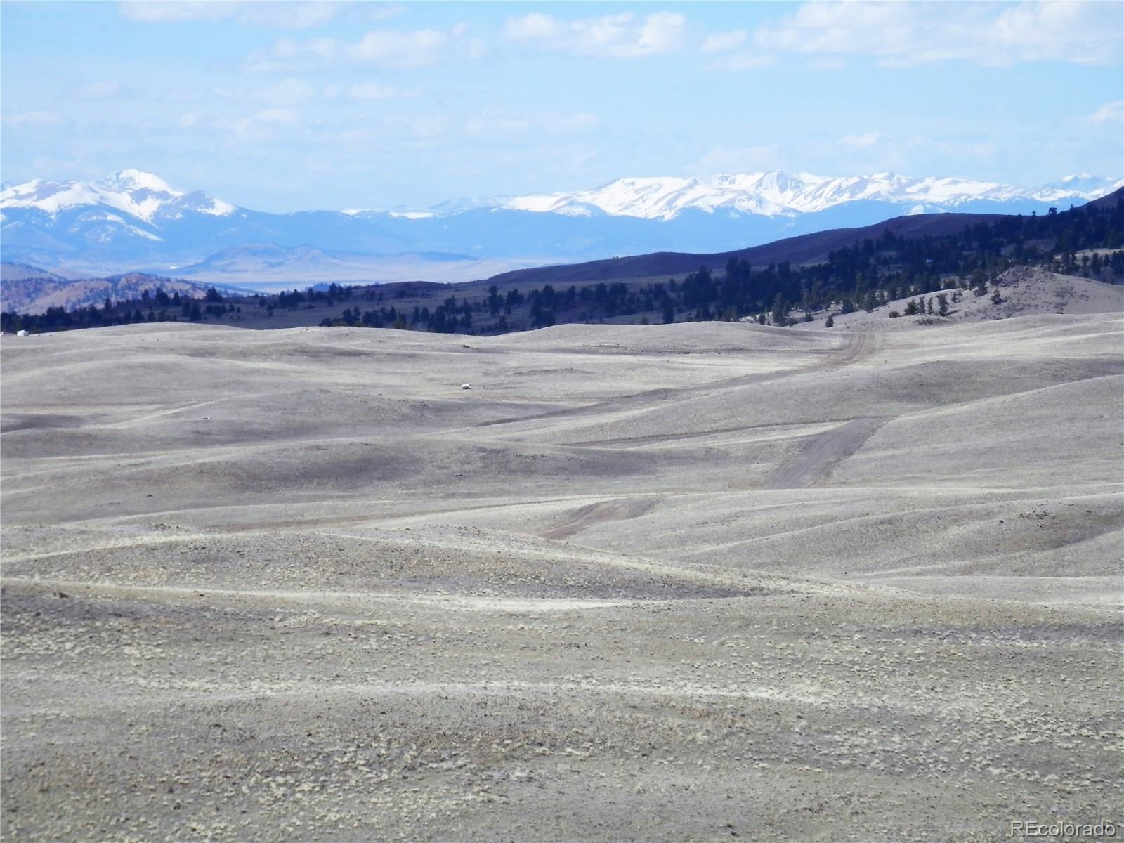 4464 Chickasaw Road Hartsel, CO 80449 - Photo 4 of 9 a view of a lake and a mountain