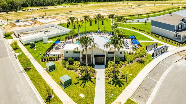 an aerial view of a house with a swimming pool