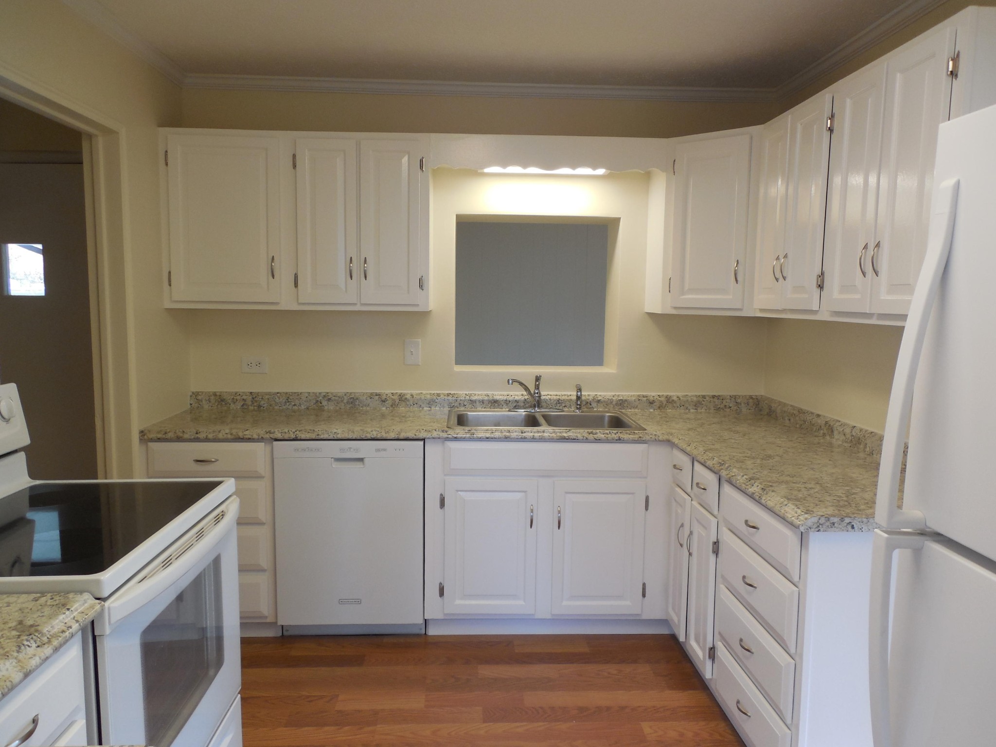 136 Pembroke Road Oak Ridge, TN 37830 - Photo 3 of 20 a kitchen with granite countertop white cabinets and stainless steel appliances