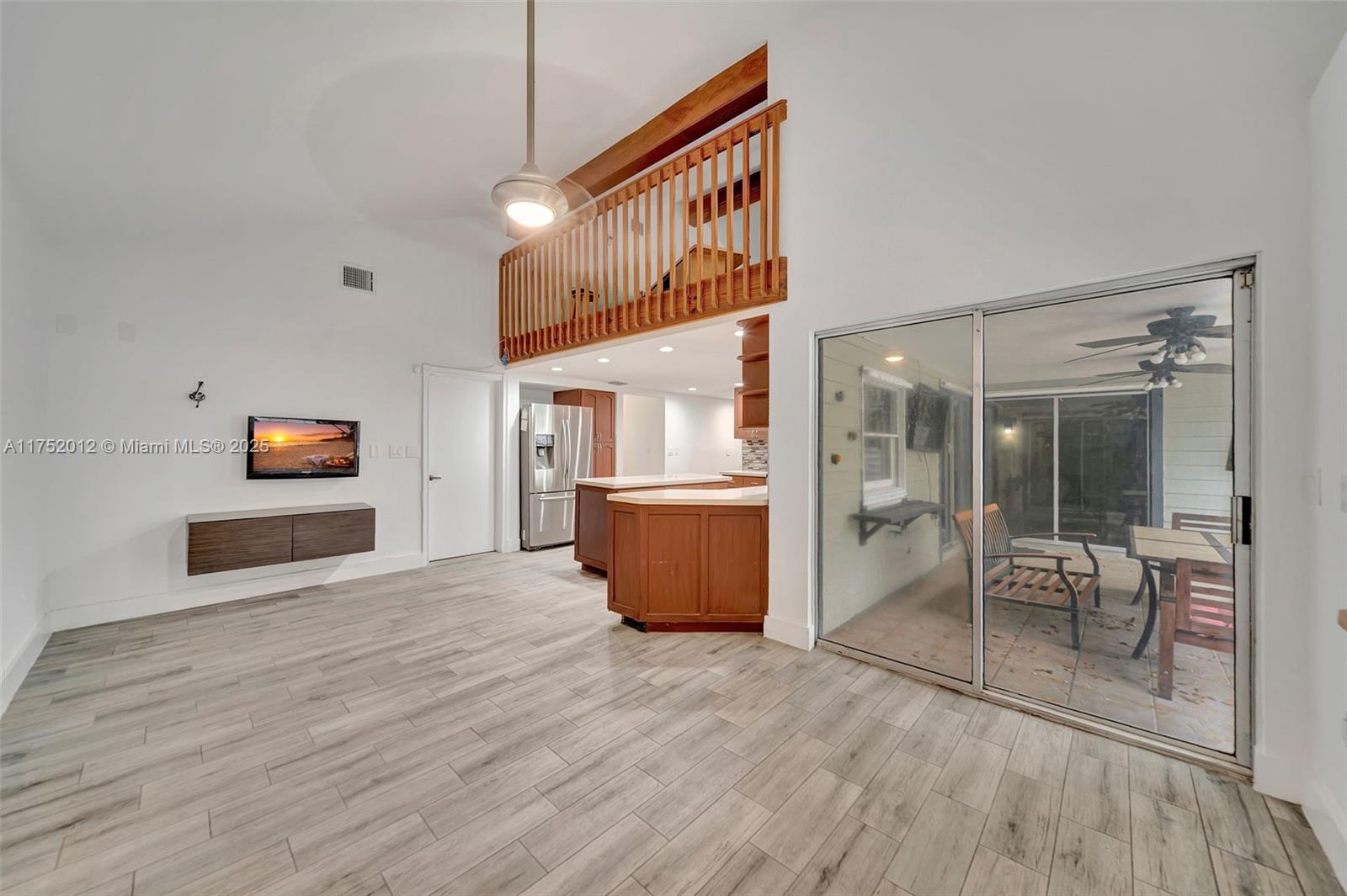 15006 Southwest 141st Court Miami, FL 33186 - Photo 12 of 27 a view of a room with wooden floor and a window