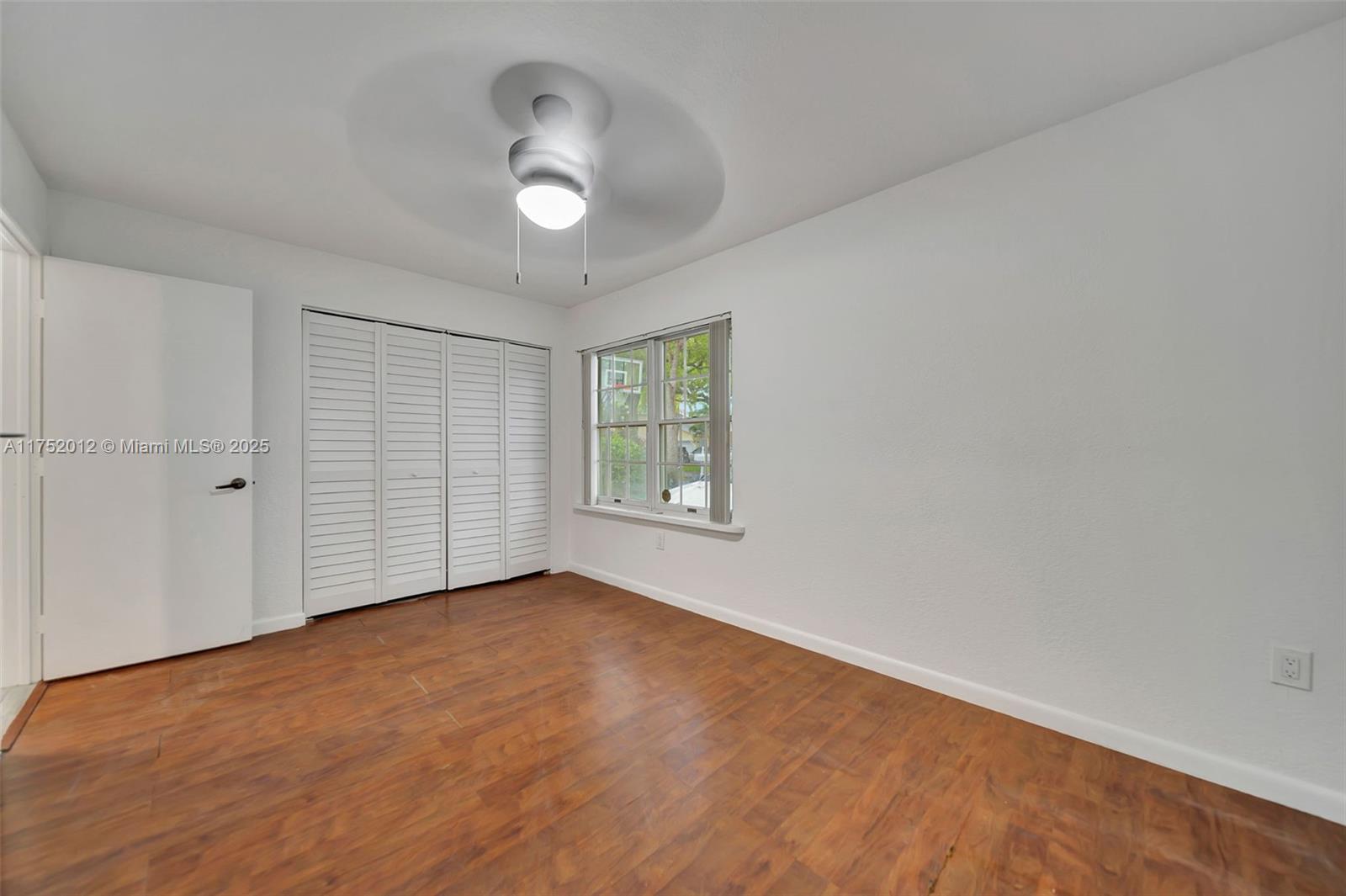15006 Southwest 141st Court Miami, FL 33186 - Photo 17 of 27 a view of an empty room with a window