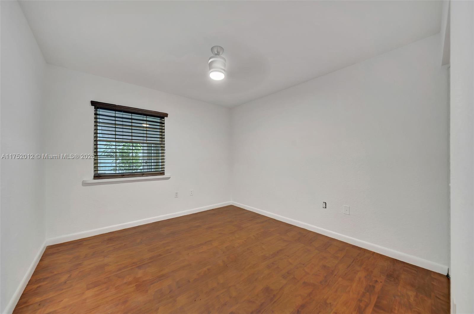 15006 Southwest 141st Court Miami, FL 33186 - Photo 20 of 27 an empty room with windows