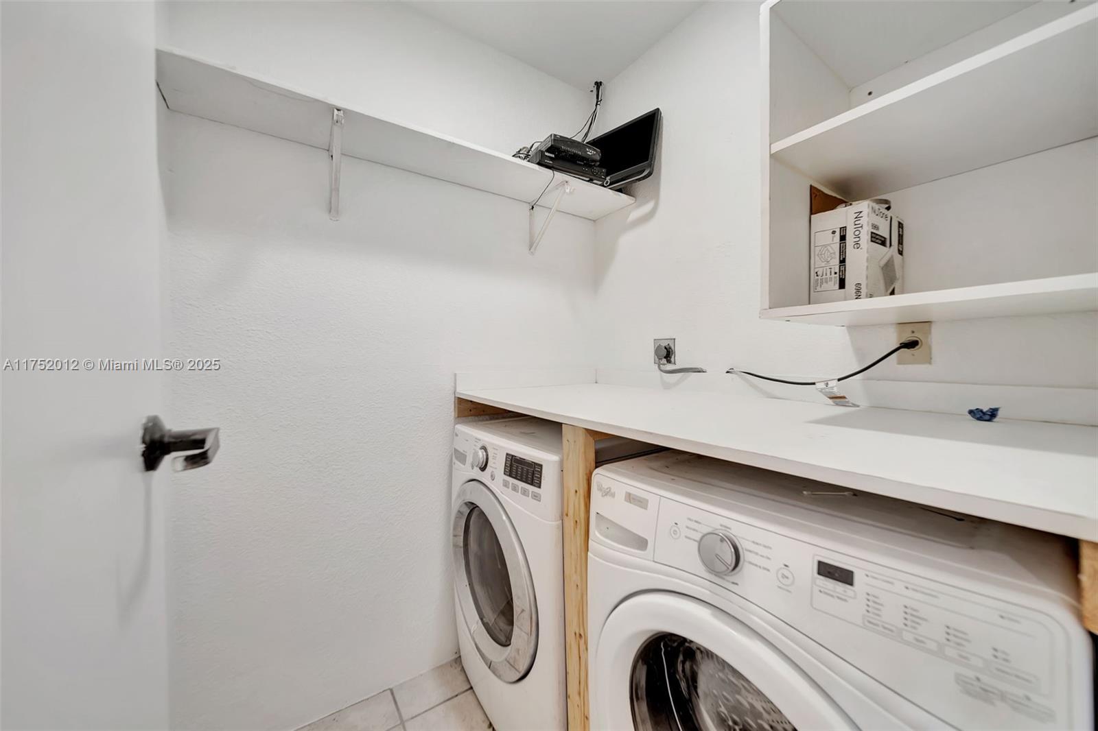 15006 Southwest 141st Court Miami, FL 33186 - Photo 22 of 27 a utility room with dryer and washer