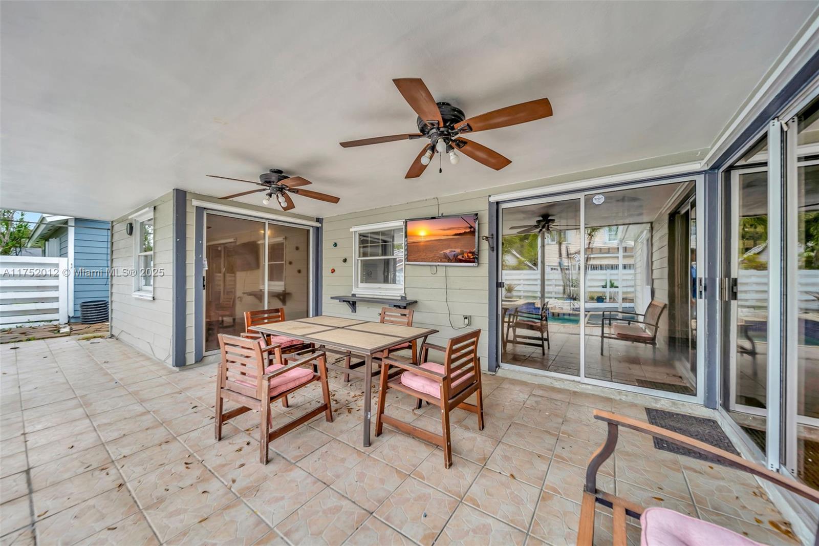 15006 Southwest 141st Court Miami, FL 33186 - Photo 23 of 27 a outdoor space with a large window and furniture