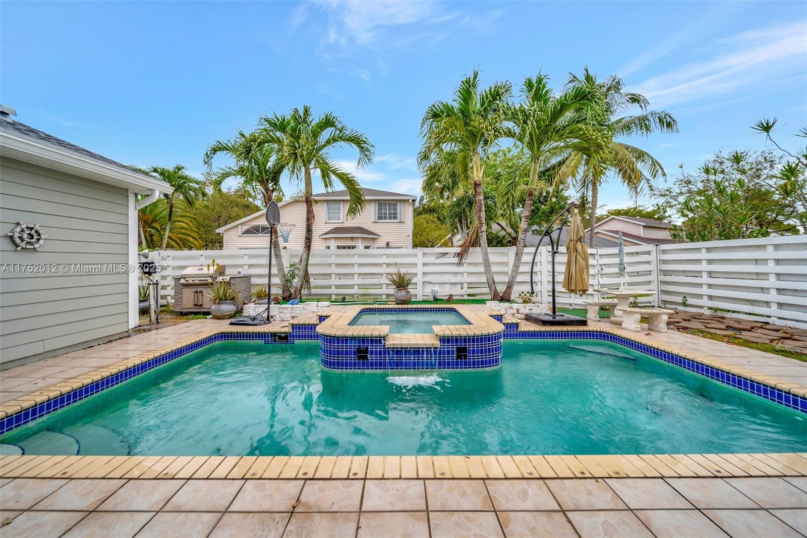 15006 Southwest 141st Court Miami, FL 33186 - Photo 24 of 27 a swimming pool with outdoor seating and yard