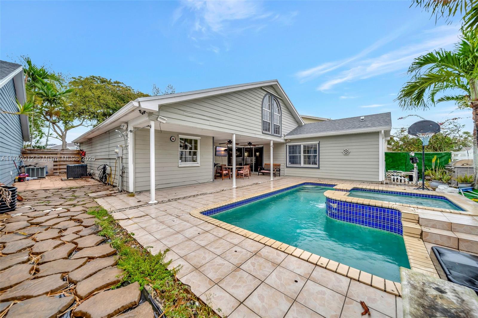 15006 Southwest 141st Court Miami, FL 33186 - Photo 25 of 27 a front view of a house with garden