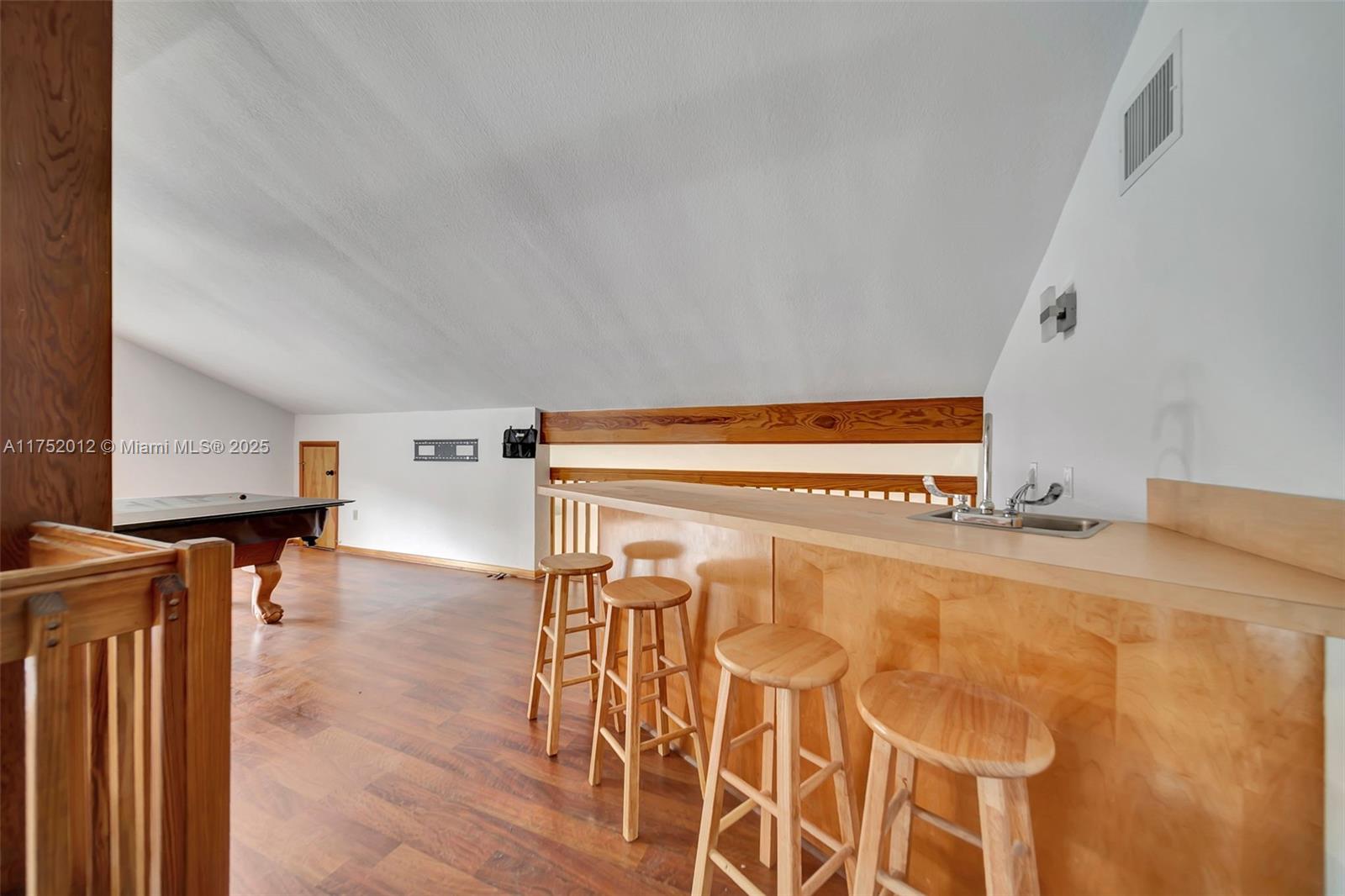 15006 Southwest 141st Court Miami, FL 33186 - Photo 5 of 27 a view of a kitchen with wooden floor