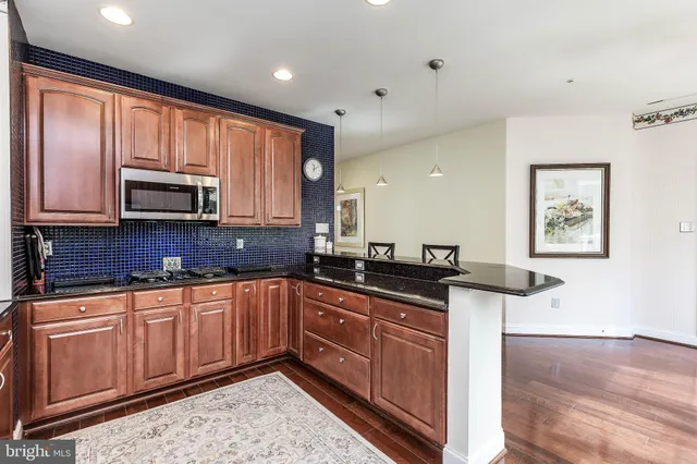 a view of a a dining room with furniture window and wooden floor