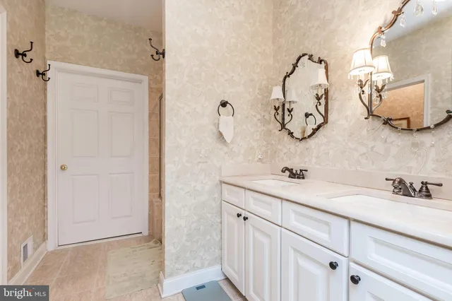 a kitchen with a refrigerator and cabinets