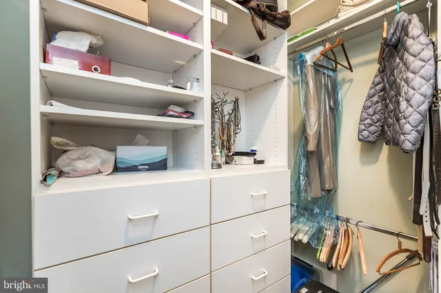 a view of a livingroom with furniture and bedroom view