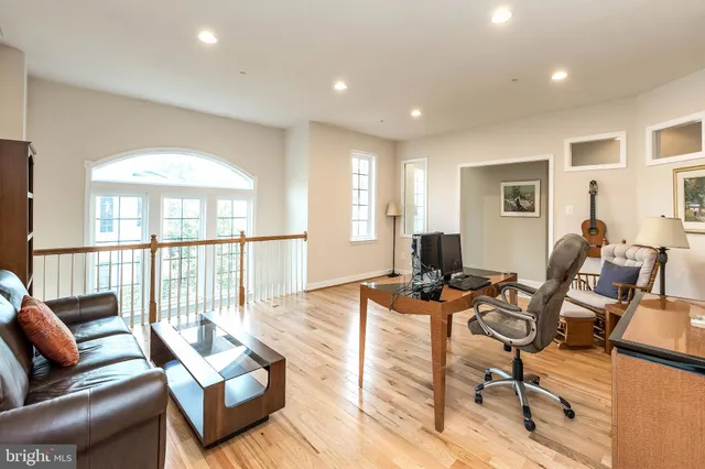 a bathroom with a granite countertop sink a mirror and a shower
