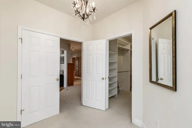 a bedroom with a bed and chair