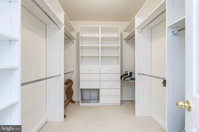 a living room with a flat screen tv and white appliances