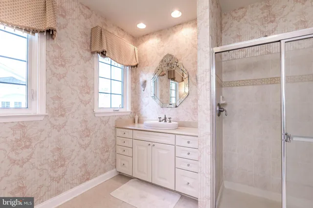a living room with furniture a piano and a bookshelf