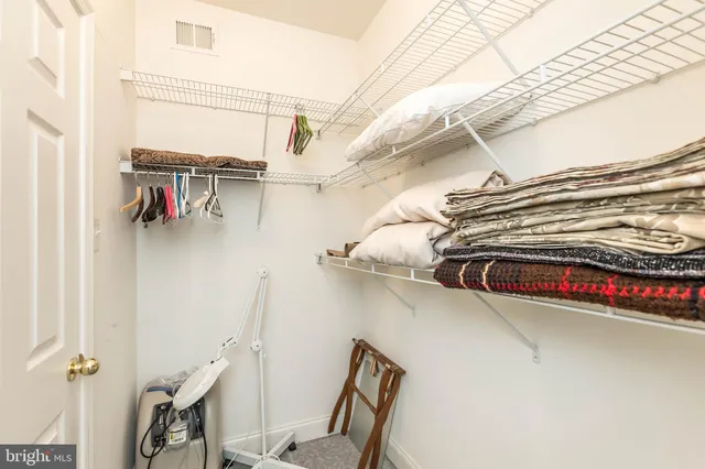 a view of a chair and table in the backyard