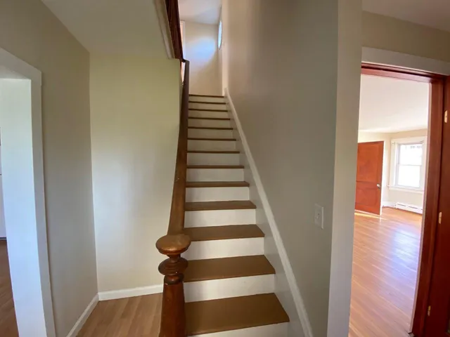 a view of entryway with wooden floor