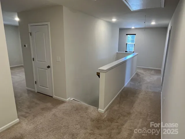 a view of hallway with stairs