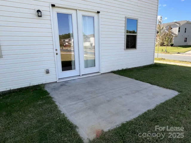 a view of backyard of a house