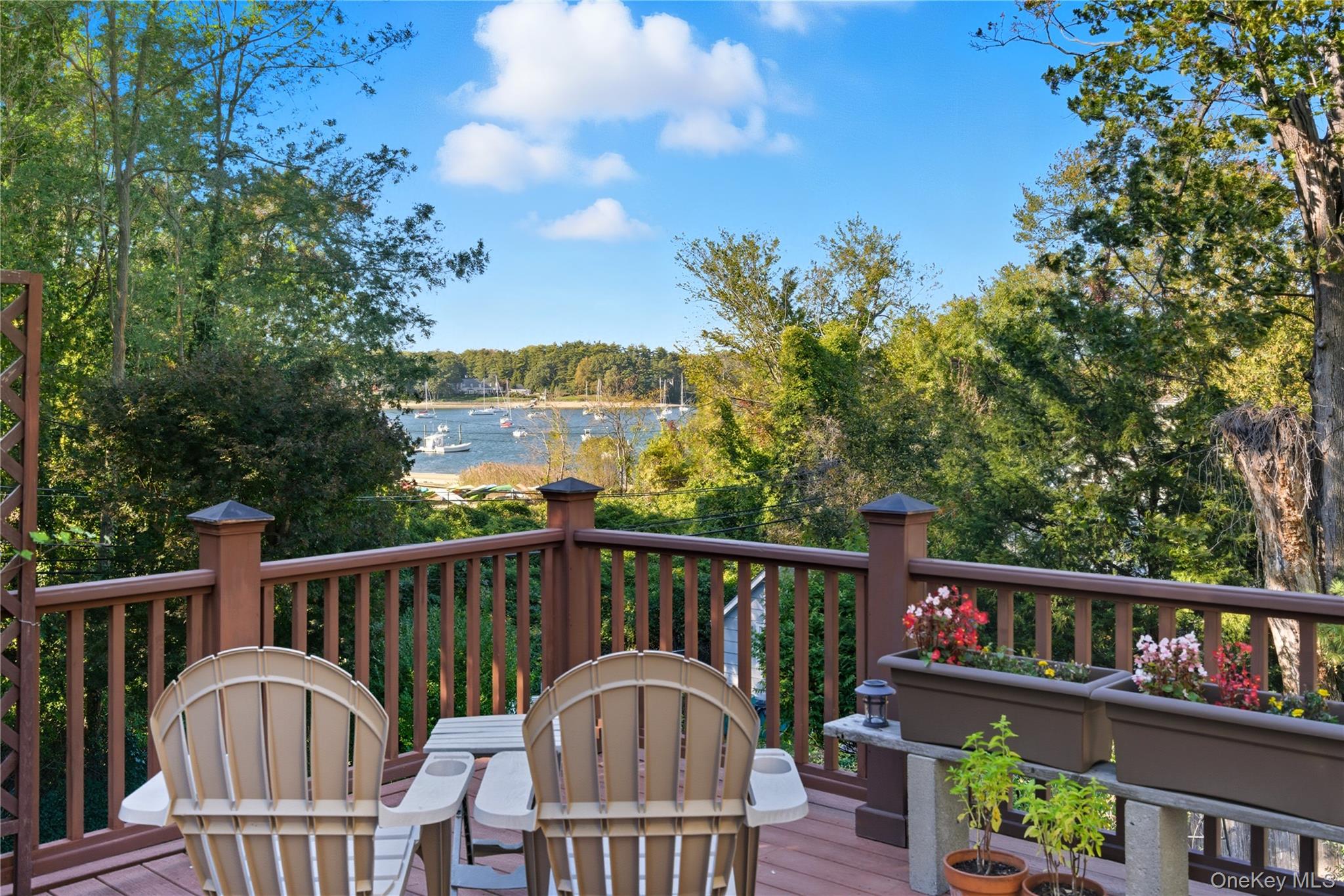 7 Landing Road Huntington, NY 11743 - Photo 1 of 42 a view of a balcony with wooden floor and fence