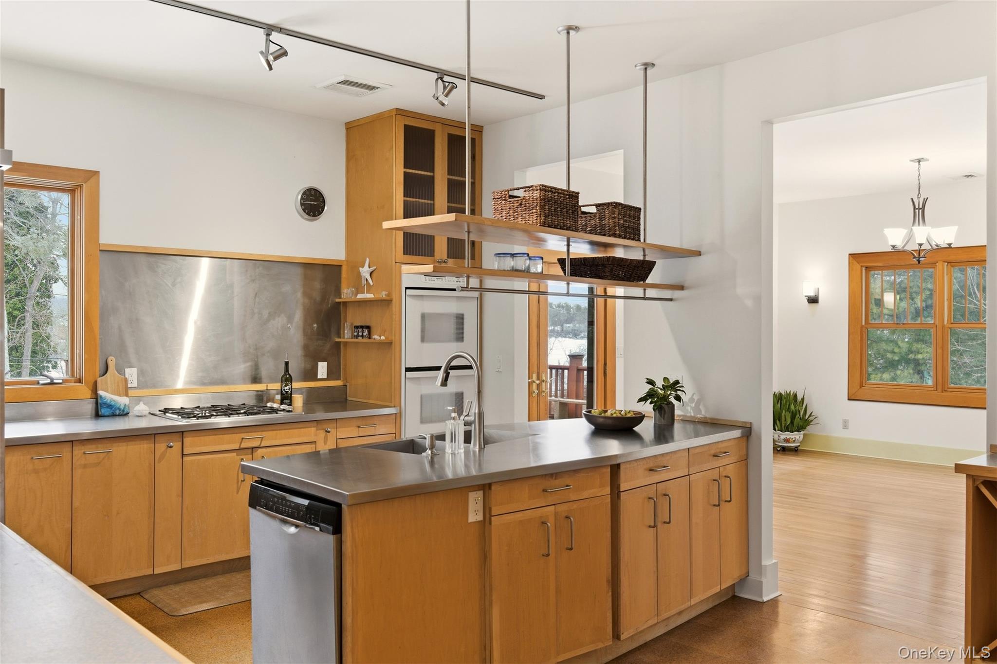 7 Landing Road Huntington, NY 11743 - Photo 13 of 42 a kitchen with stainless steel appliances granite countertop a sink a stove and a wooden floor