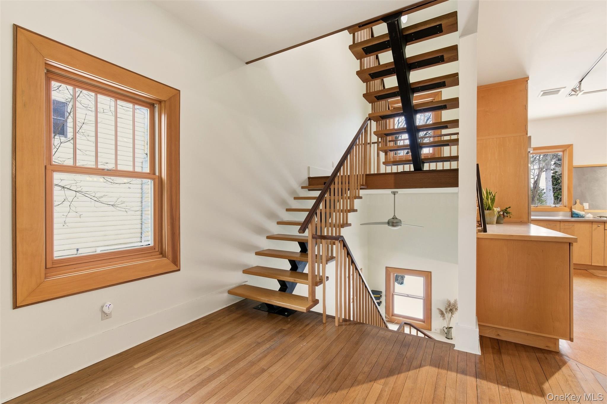 7 Landing Road Huntington, NY 11743 - Photo 14 of 42 a view of entryway with wooden floor and stairs