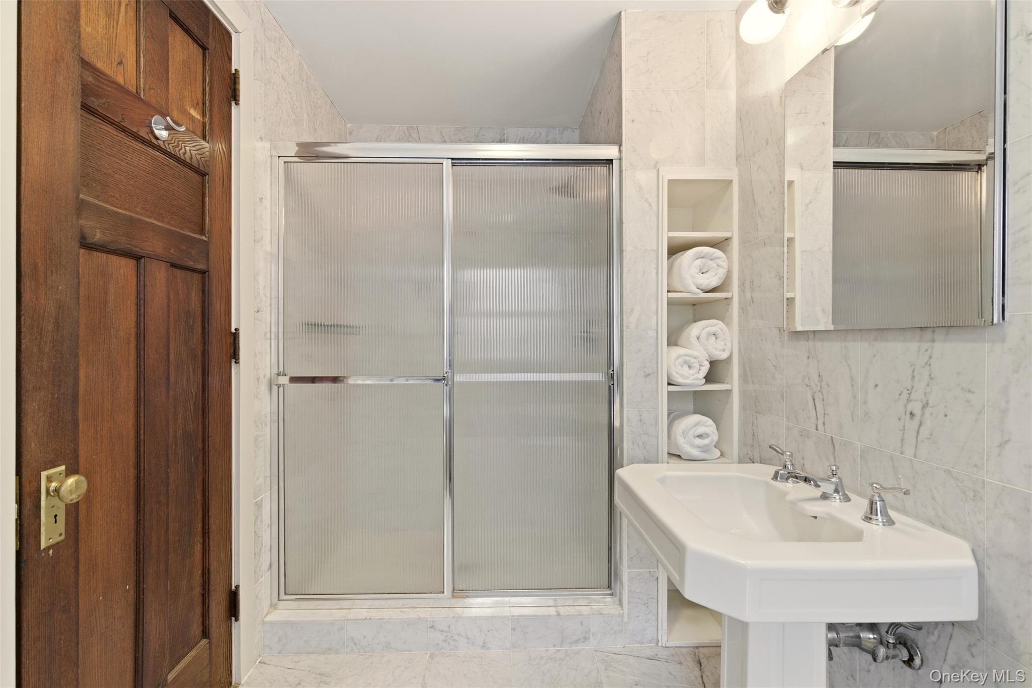 7 Landing Road Huntington, NY 11743 - Photo 18 of 42 a bathroom with a sink shower and a mirror