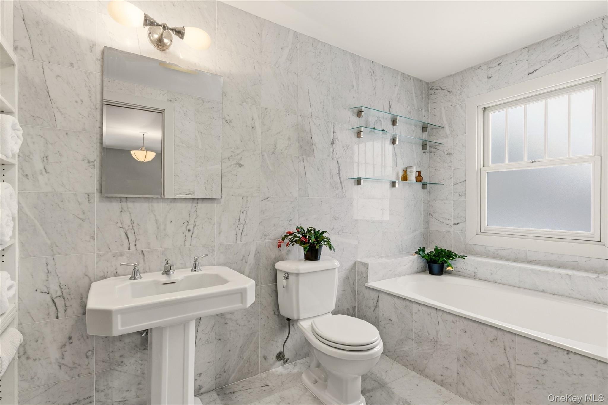 7 Landing Road Huntington, NY 11743 - Photo 19 of 42 a bathroom with a sink toilet and shower