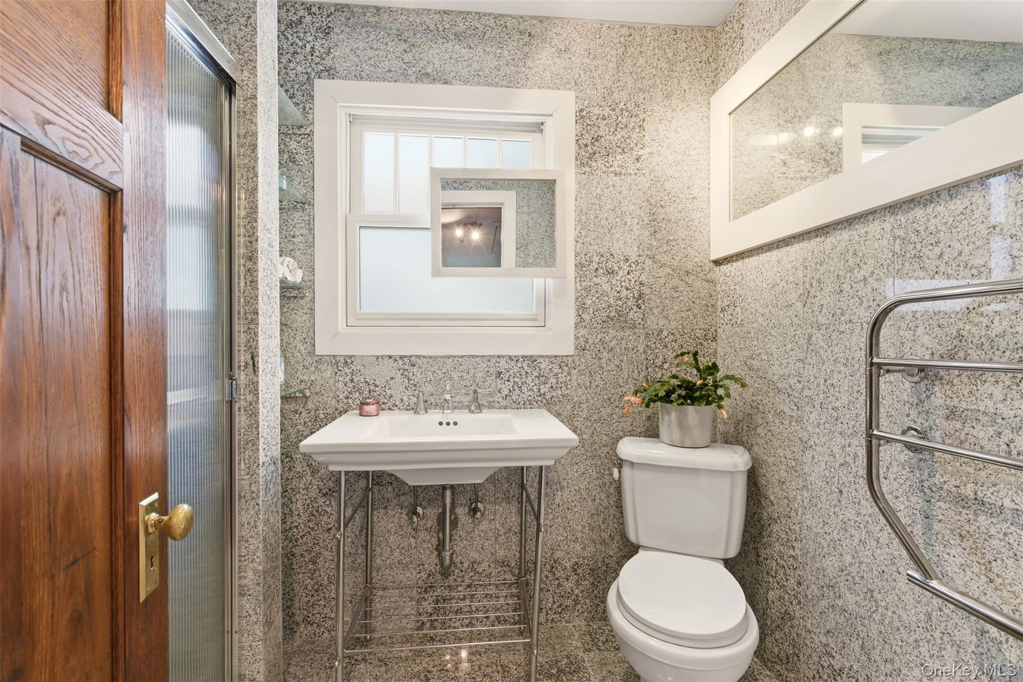 7 Landing Road Huntington, NY 11743 - Photo 23 of 42 a bathroom with a toilet sink and mirror