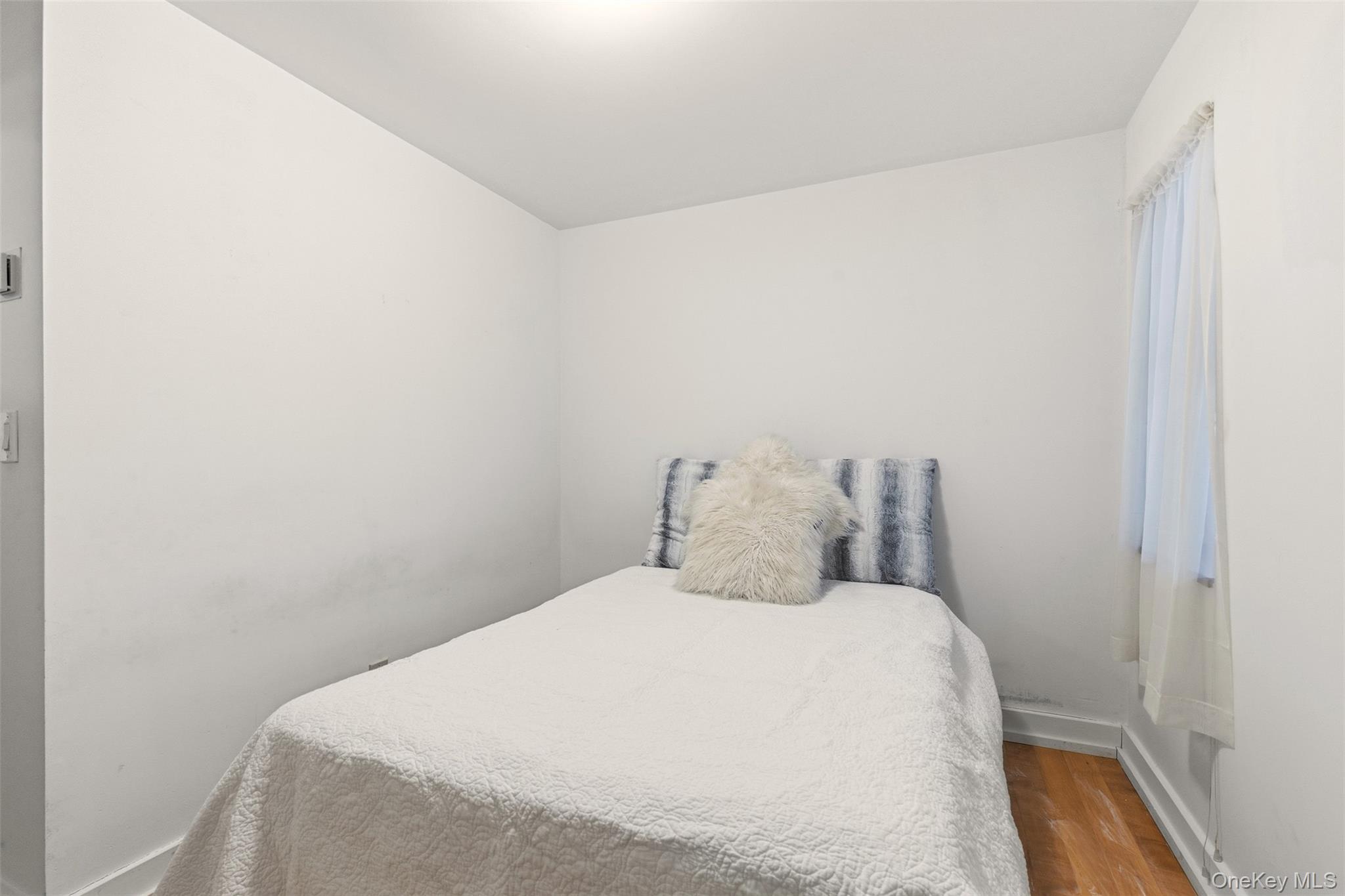 7 Landing Road Huntington, NY 11743 - Photo 30 of 42 a bedroom with a bed and a mirror