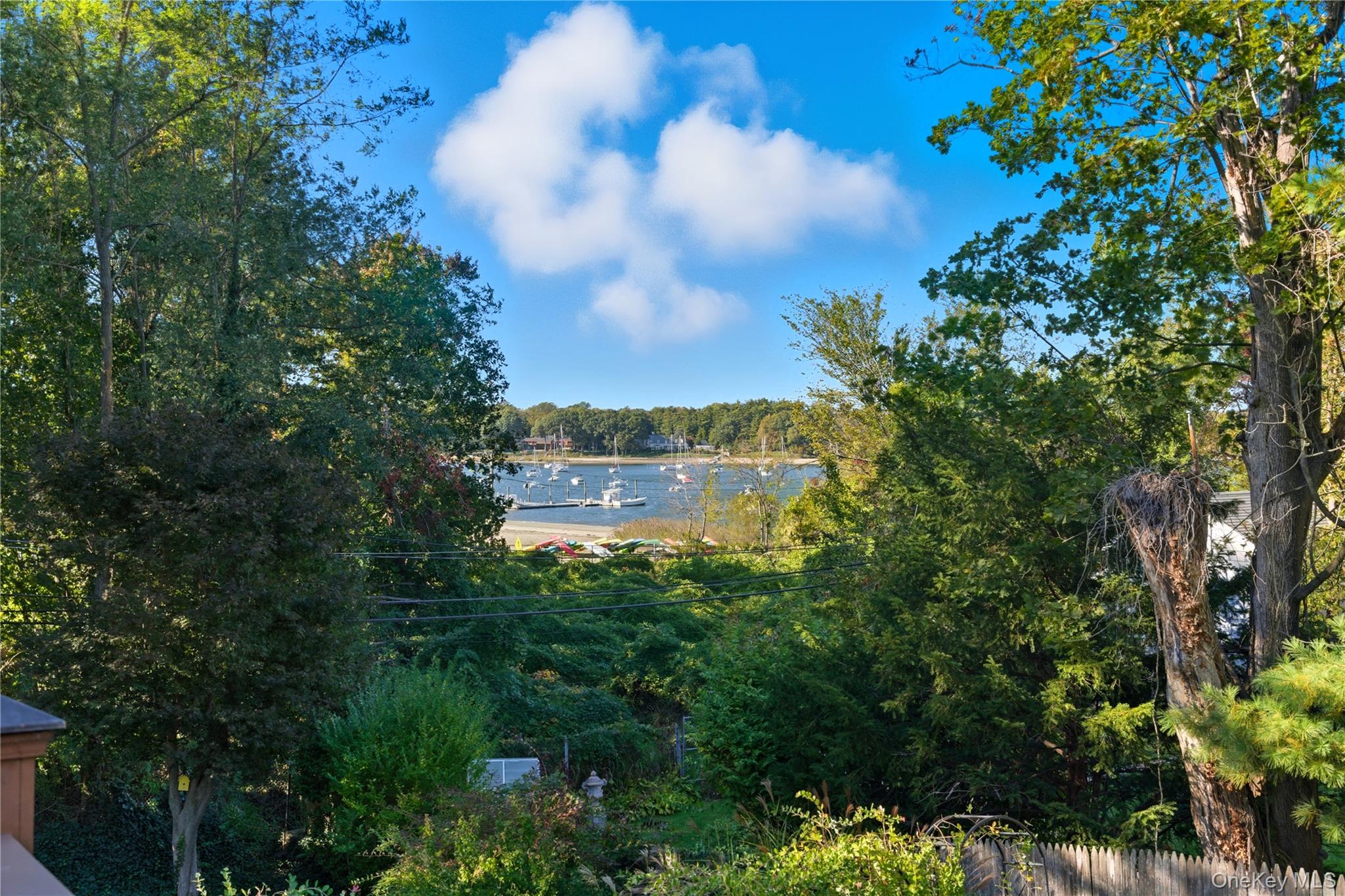 7 Landing Road Huntington, NY 11743 - Photo 32 of 42 a view of lake with house in background