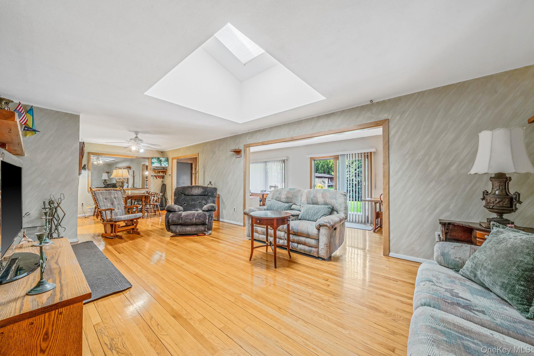 280 Deforest Road North Dix Hills, NY 11746 - Photo 15 of 37 a living room with furniture and a wooden floor