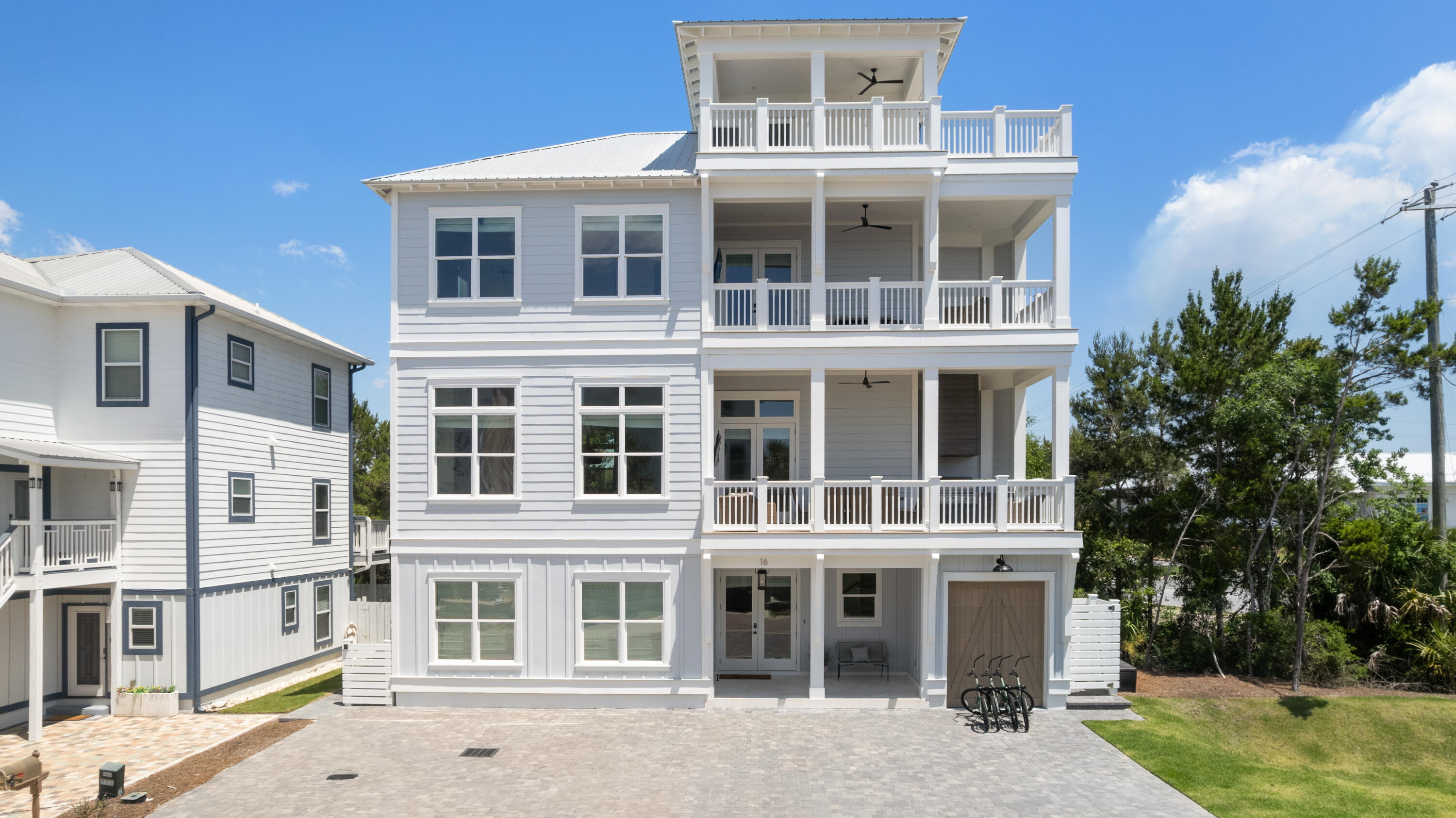 16 Bluewater View Ave Inlet Beach Inlet Beach, FL 32461 - Photo 51 of 59 a front view of a building with a garden